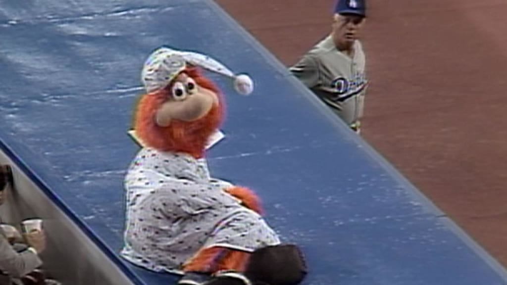 Lasorda emerges from the Dodgers' dugout to confront a trespassing Youppi. Lasorda emerges from the Dodgers' dugout to confront a trespassing Youppi.