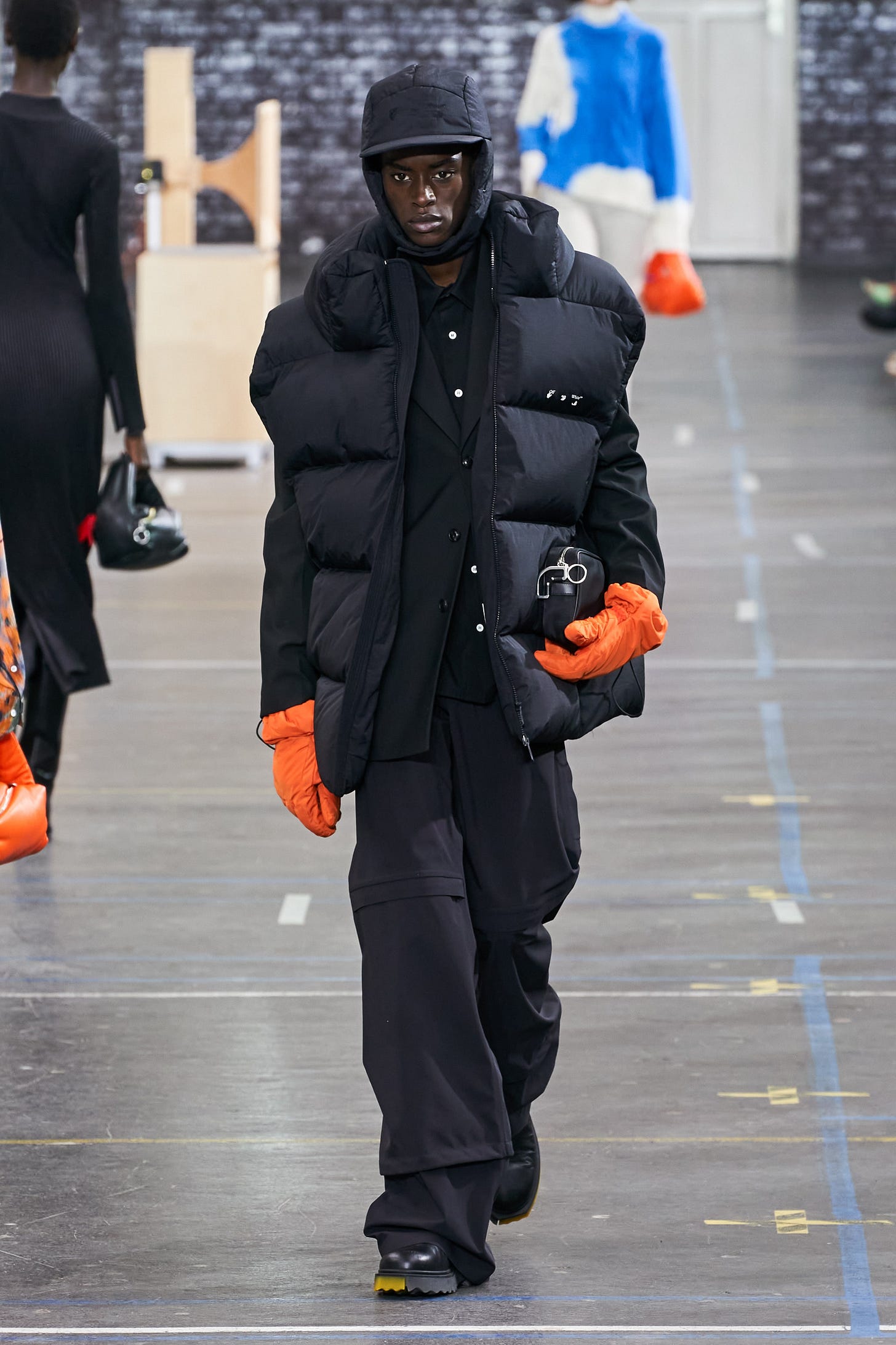 Image may contain Clothing Apparel Human Person Helmet Sleeve and Runway