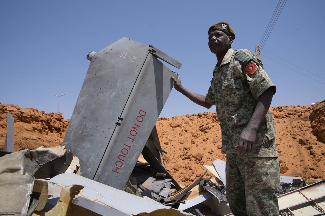 A man stands in a hole filled with drone components on March 29, 2026, in El-Obeid, Sudan. A man stands in a hole filled with drone components on March 29, 2026, in El-Obeid, Sudan.