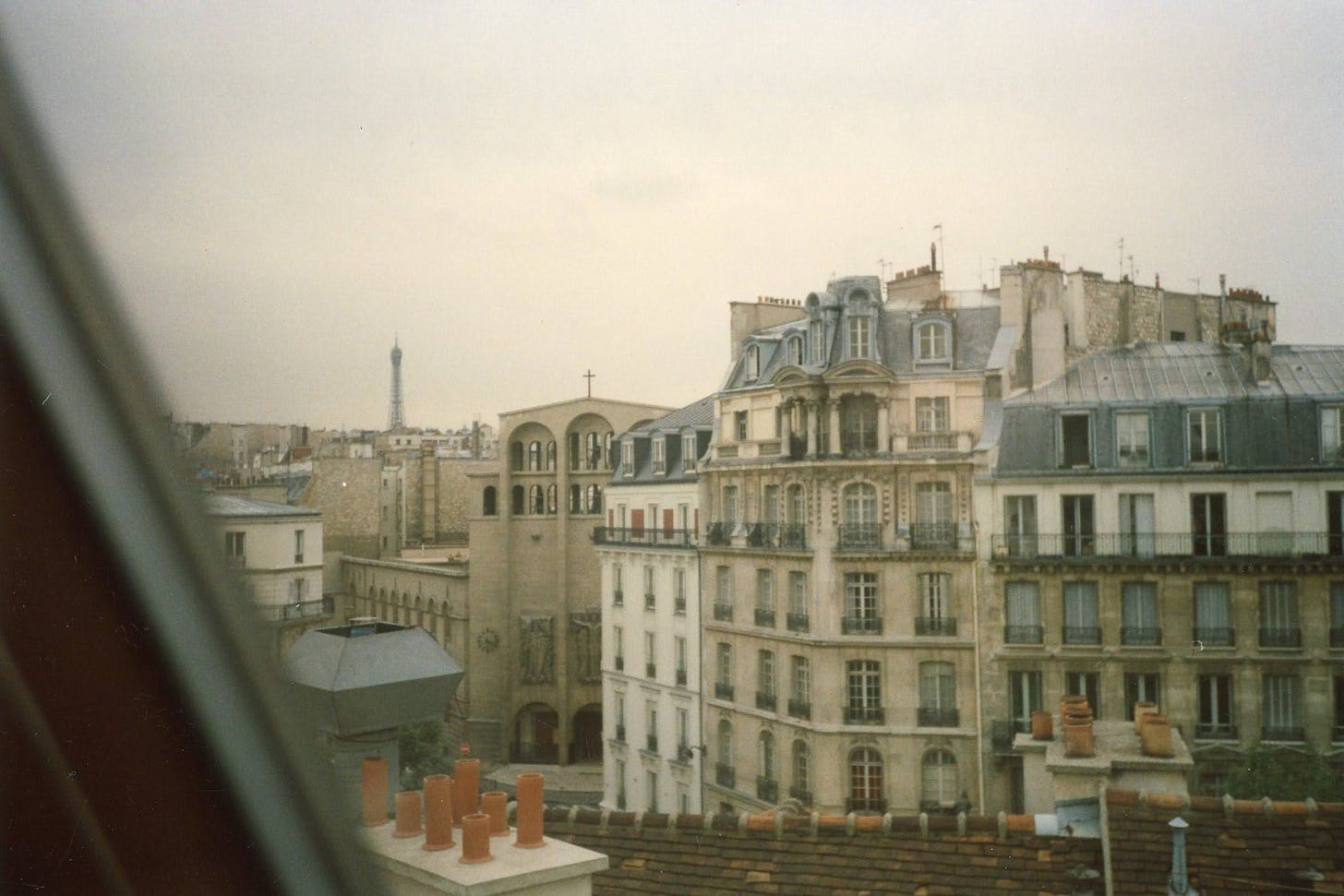 buildings in Paris with the eiffel tower off in the distance buildings in Paris with the eiffel tower off in the distance