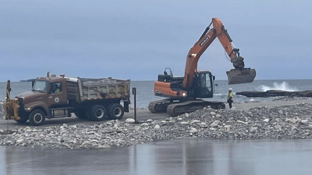 Cleanup crews at work following a March storm.