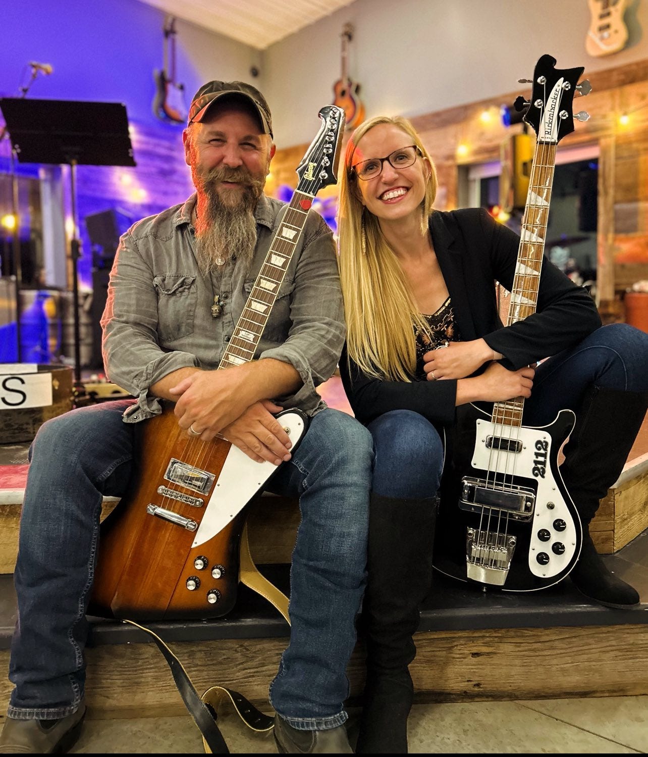 May be an image of 2 people, guitar and text