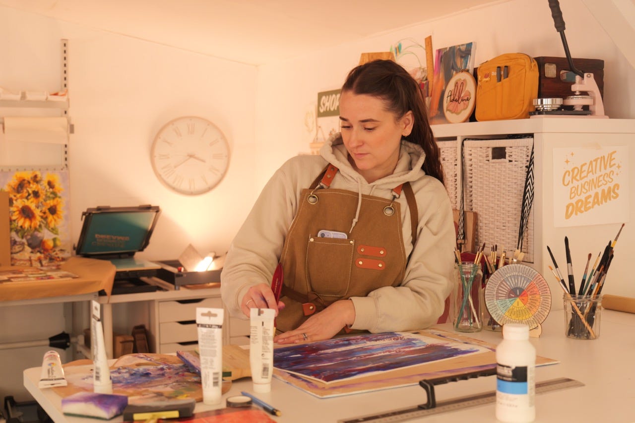 women in her art studio making an expressive theraputic art piece