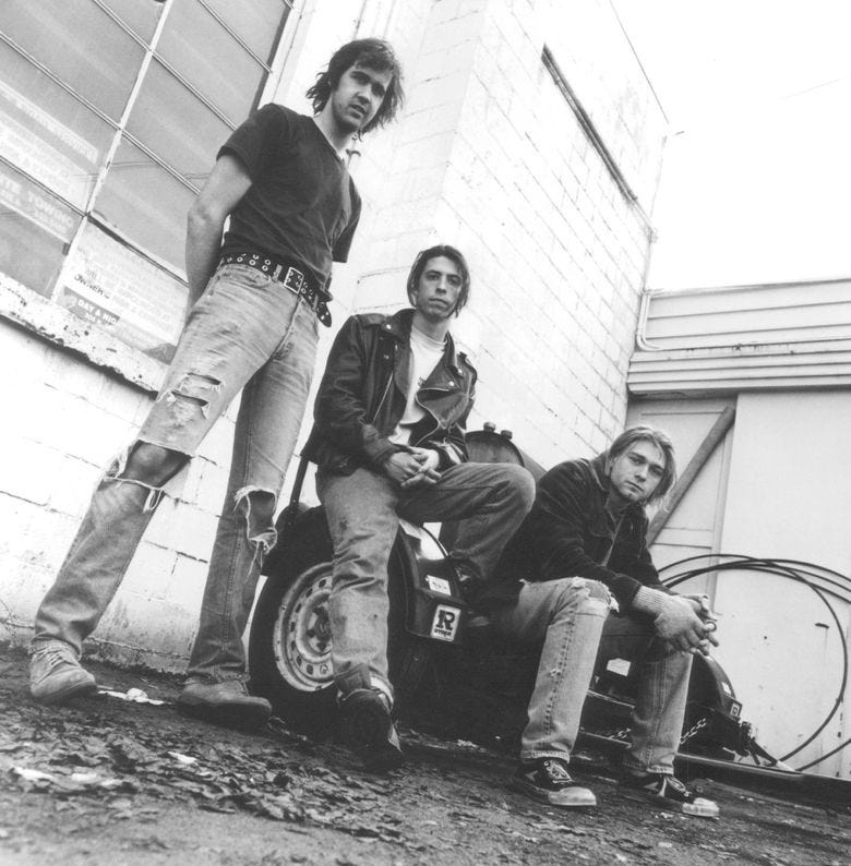 Nirvana’s Krist Novoselic, Dave Grohl and Kurt Cobain in 1991, the year the band’s landmark “Nevermind” was released. (Chris Cuffaro / The Associated Press) Nirvana’s Krist Novoselic, Dave Grohl and Kurt Cobain in 1991, the year the band’s landmark “Nevermind” was released. (Chris Cuffaro / The Associated Press)