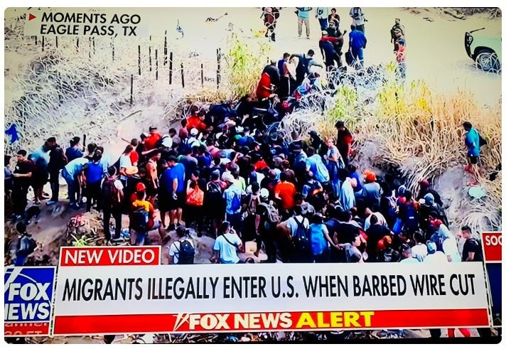 Hundreds of migrants rush the Texas Border after a barbed wire barrier along the Rio Grande is cut on September 25, 2023, (US Border News screenshot of Fox News coverage) Hundreds of migrants rush the Texas Border after a barbed wire barrier along the Rio Grande is cut on September 25, 2023, (US Border News screenshot of Fox News coverage)