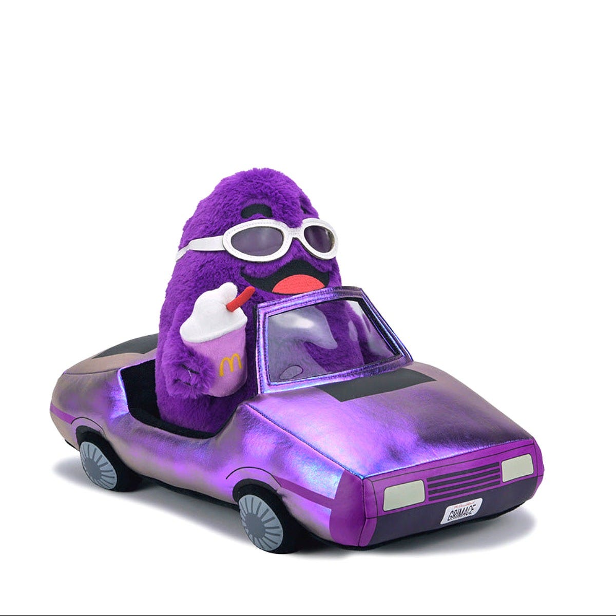 Grimace behind the wheel of the Kidrobot plush car. Image: Kidrobot Grimace behind the wheel of the Kidrobot plush car. Image: Kidrobot