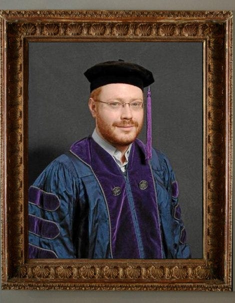 Yes, this is my actual H̶o̶g̶w̶a̶r̶t̶s̶ law school graduation photo.