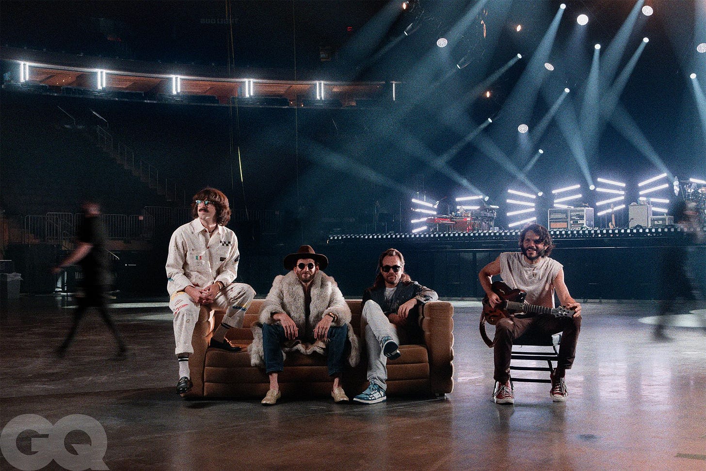 Image may contain Lighting Stage Adult Person Clothing Footwear Shoe Concert Crowd Hat and Guitar