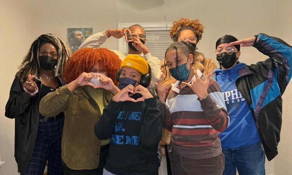 Image: The founding group of anti-capitalist collective BarterUp wearing various outfits signifying cold weather though they are indoors Image: The founding group of anti-capitalist collective BarterUp wearing various outfits signifying cold weather though they are indoors