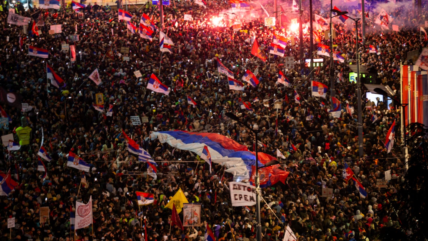 Thousands of protesters, some waving flags, take part in one of the largest anti-corruption demonstrations