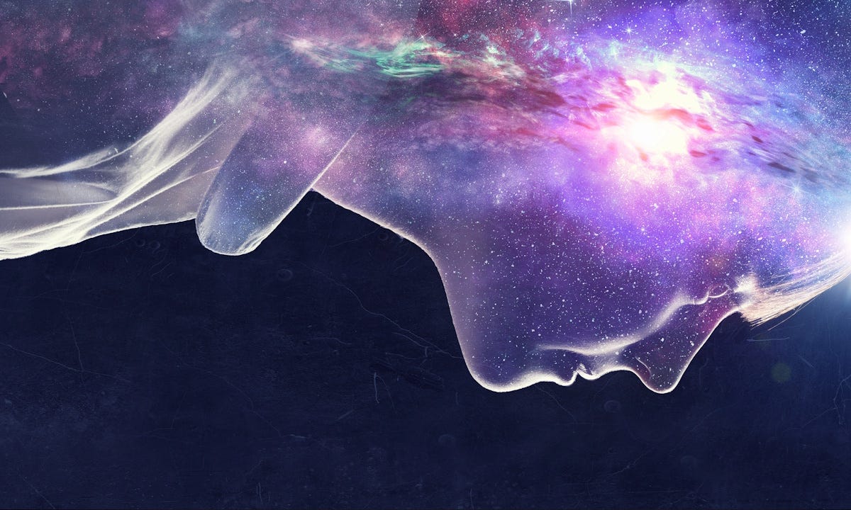 Transparent profile of a young woman against a black background with the universe behind her