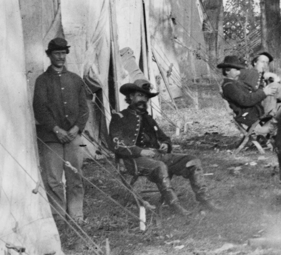 A dashing figure from the 'Evening music at General Alfred Pleasonton's headquarters' photograph, captured in October 1863, Auburn, Virginia, during the Civil War.