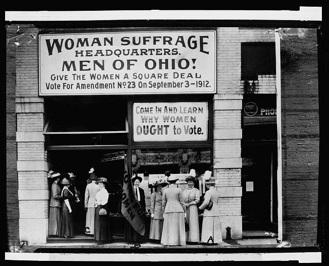 Woman suffrage headquarters in Upper Euclid Avenue, Cleveland--A. (at extreme right) is Miss Belle Sherwin, President, National League of Women Voters; B. is Judge Florence E. Allen (holding the flag); C. is Mrs. Malcolm McBride