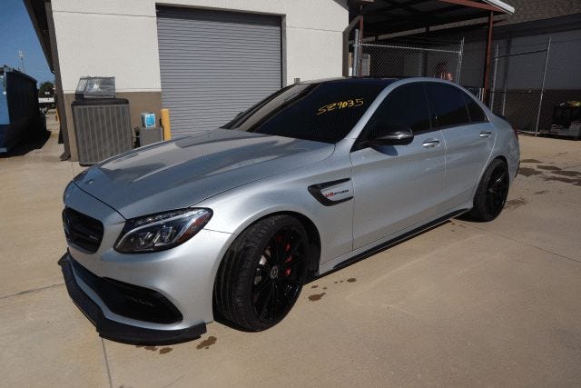 A silver Mercedes-Benz AMG C63