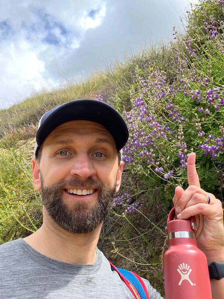 A person holding a red bottle

Description automatically generated with low confidence