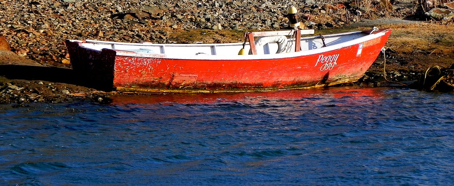 A red boat on the water.