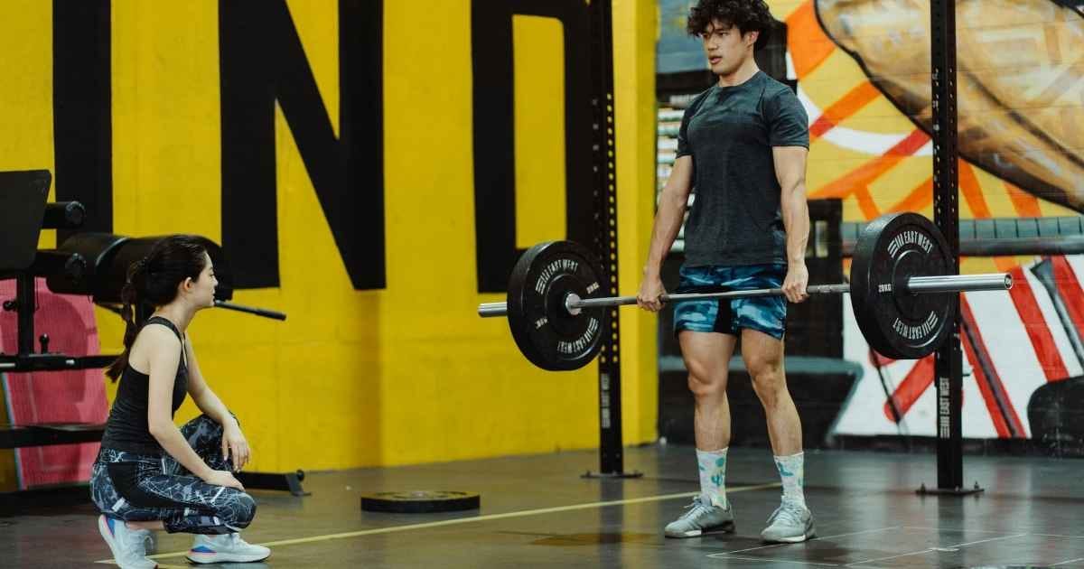 A Young Man doing a barbell deadlift