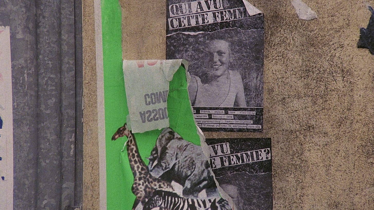 The Vanishing | Still features torn posters of a missing person.
