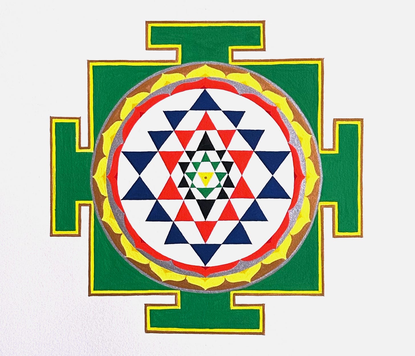 A hand-painted Sri Yantra in gouache, with interlocking red, blue, green, and black shapes forming the central geometry, surrounded by a circle of red and yellow lotus petals and bhupur. A hand-painted Sri Yantra in gouache, with interlocking red, blue, green, and black shapes forming the central geometry, surrounded by a circle of red and yellow lotus petals and bhupur.