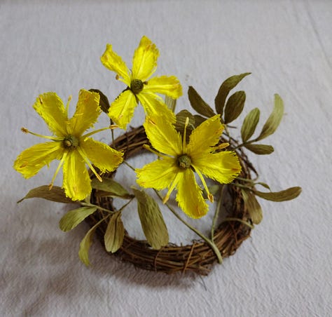 A range of different flowers created from paper and coloured using natural dyes including Weld, Onion Skins, Madder and Beetroot