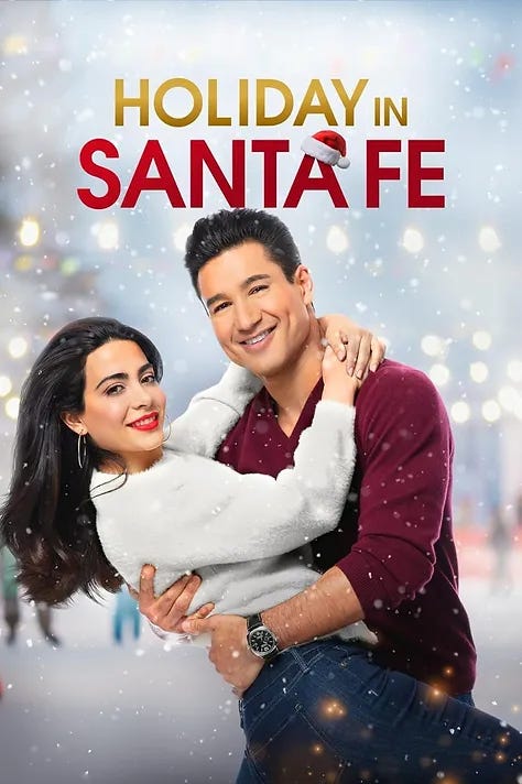 Movie poster. Title: Holiday in Santa Fe. The poster is a photograph of the two romantic leads, Mario Lopez and a woman, in the snow, hugging.