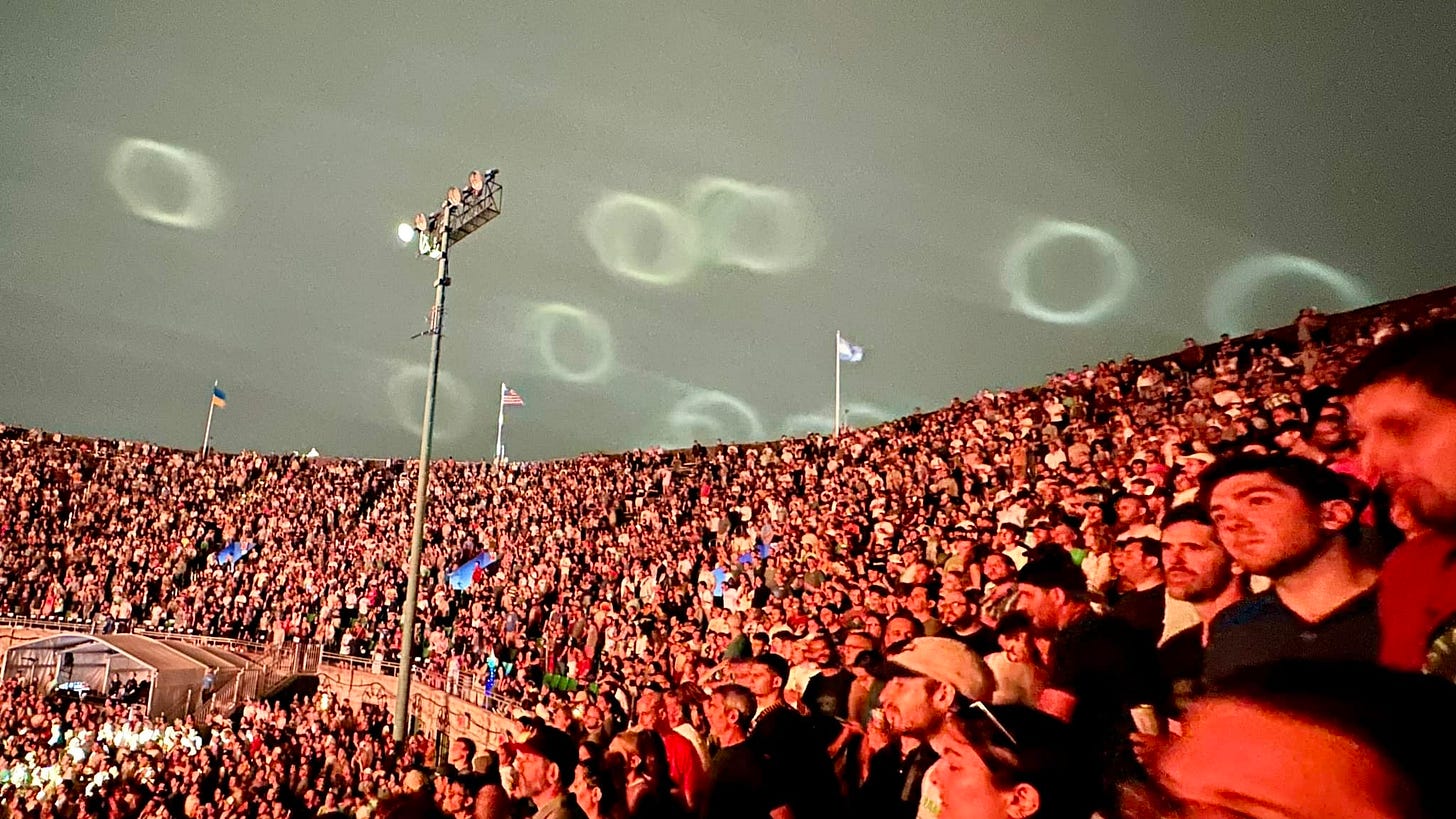 May be an image of 2 people and crowd