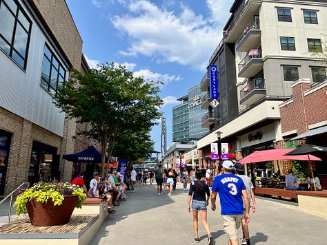 street, buildings, people, signs, sky