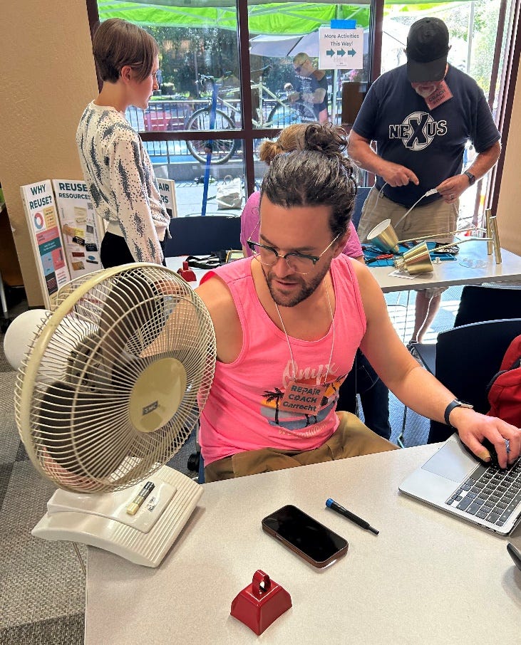 A person sitting at a desk with a fan

AI-generated content may be incorrect.