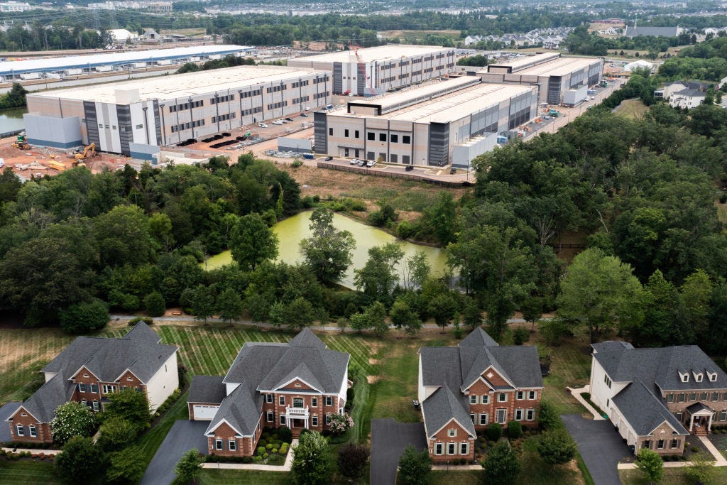 An aerial view shows a data center situated near single-family homes. (Photo by Nathan Howard/Getty Images) An aerial view shows a data center situated near single-family homes. (Photo by Nathan Howard/Getty Images)