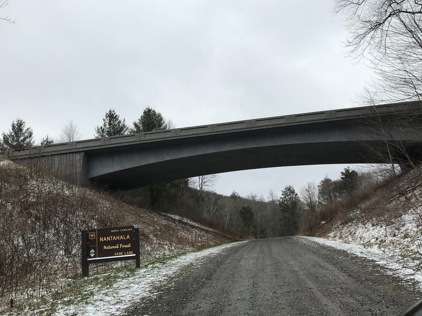 underneath the cherohala skyway on gravel road underneath the cherohala skyway on gravel road