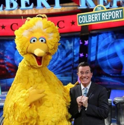 May be an image of 1 person, television and text that says 'ENM THE DUA COLBERT REPORT C'