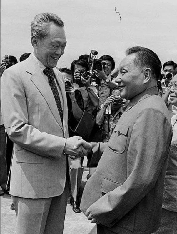 A person shaking hands with another person

Description automatically generated