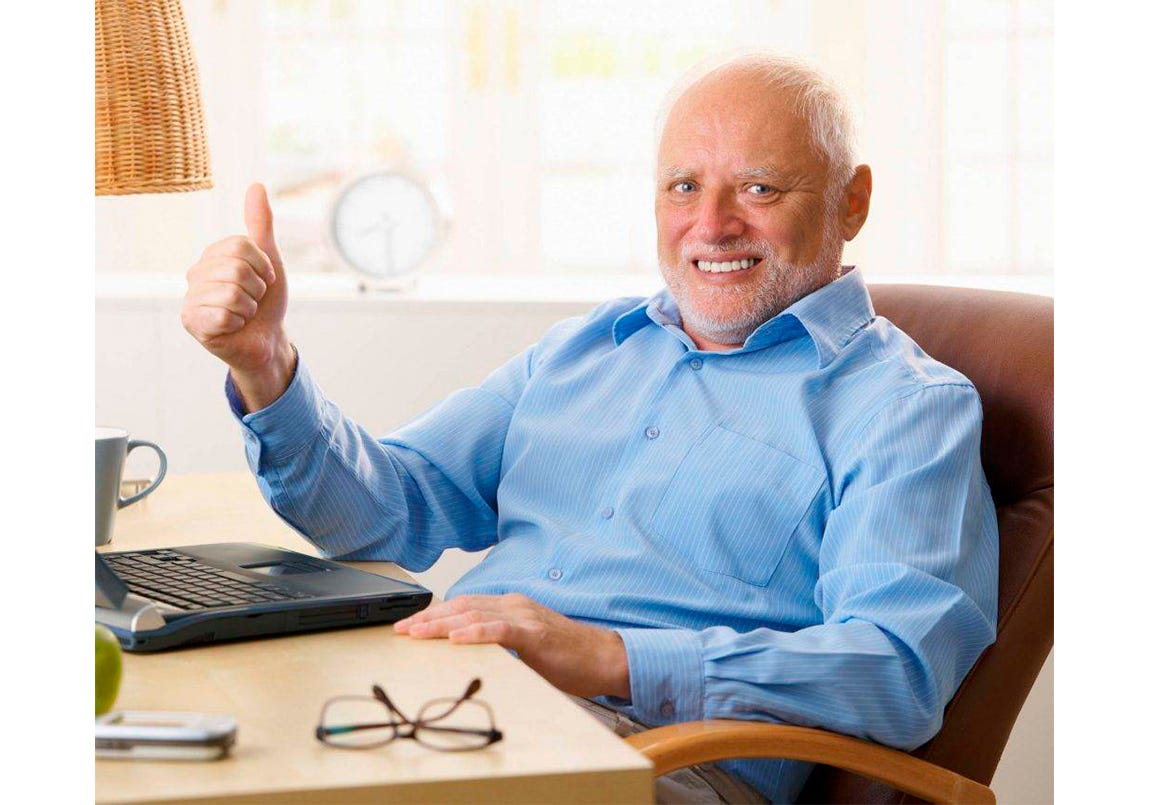 Hide the Pain Harold meme with man who has a strained smile holding a thumbs up