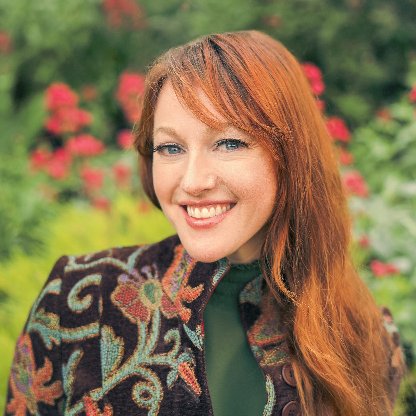A woman smiles at the camera