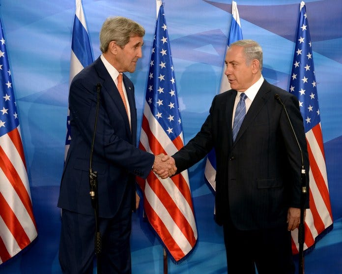 A couple of men shaking hands in front of flags
Description automatically generated A couple of men shaking hands in front of flags
Description automatically generated