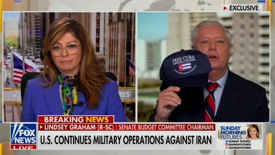 Lindsey Graham showing off some MAGA Nazi merch.