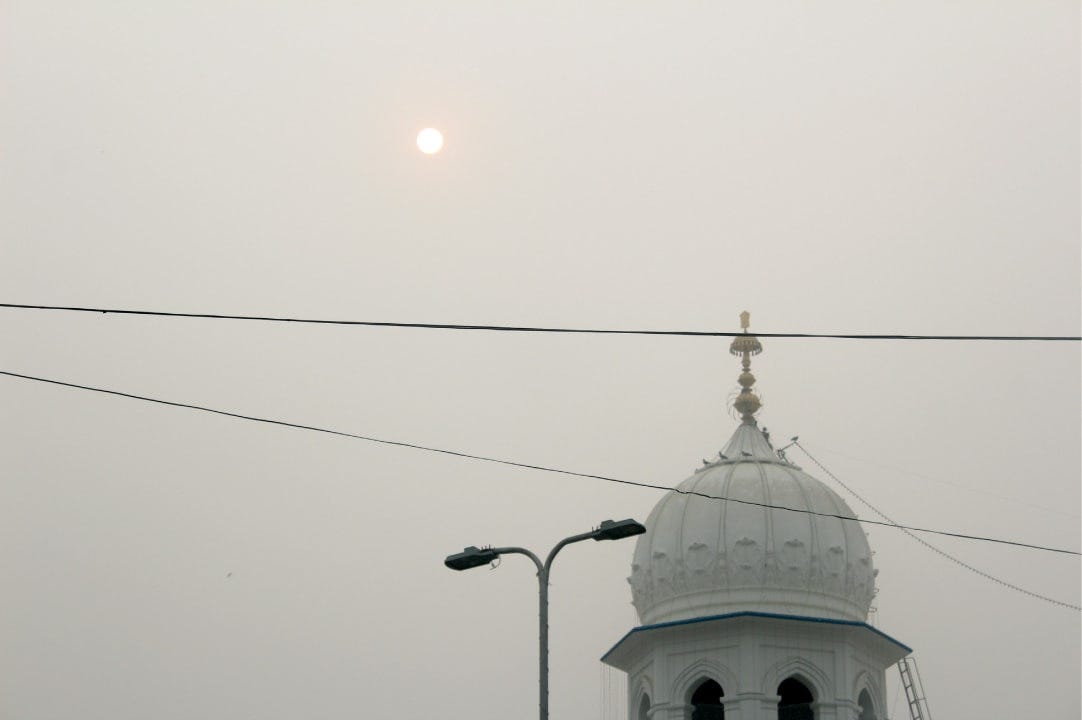 The sun sets over Nankana Sahib