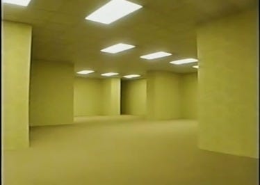 A frame from Kane Parsons' Backrooms series depicting an endless expanse of yellow-tinted rooms under fluorescent lights. The nearly identical walls, corners, and corridors provide no clear sense of direction, evoking the unsettling feeling of being lost in a place that should make sense but doesn't. A frame from Kane Parsons' Backrooms series depicting an endless expanse of yellow-tinted rooms under fluorescent lights. The nearly identical walls, corners, and corridors provide no clear sense of direction, evoking the unsettling feeling of being lost in a place that should make sense but doesn't.