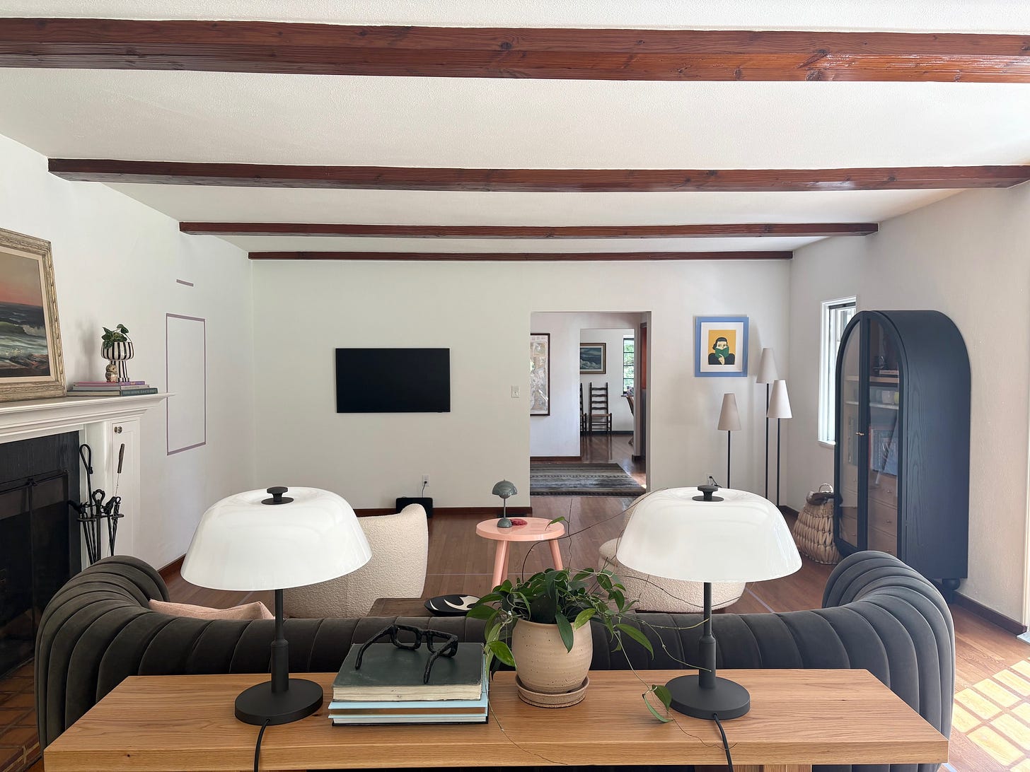 anthropologie, wood beams, ceiling beams, velvet sofa, green sofa, living room design, interior design, indoor plants, rejuvenation, frame TV, custom design, south facing light, display case, fireplace, living, Lake Oswego, Oregon living