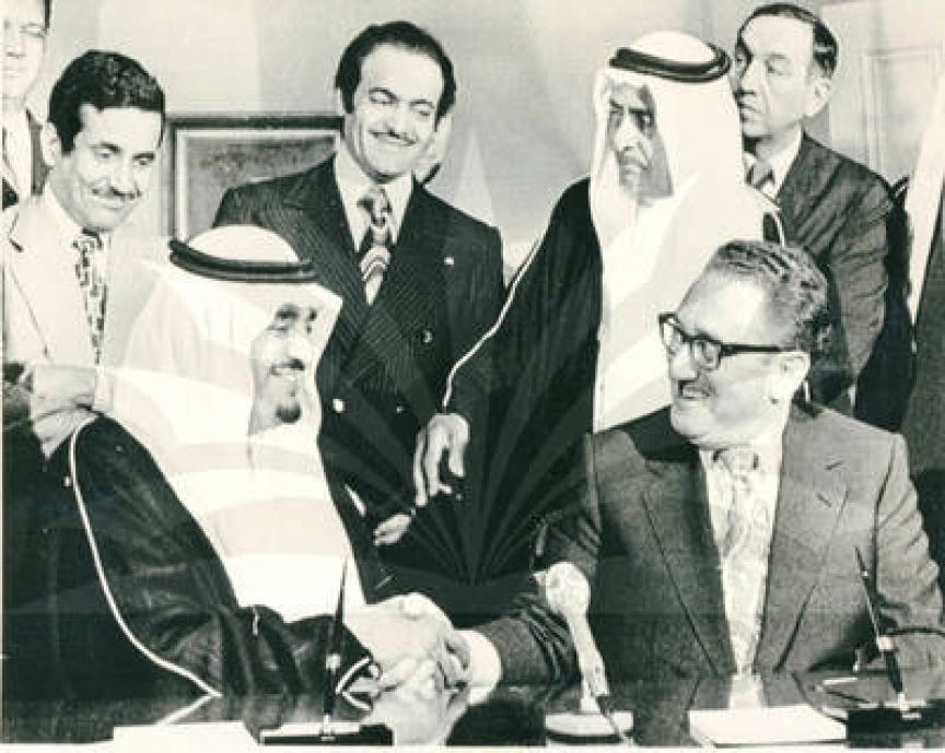 King Faisal shakes hands with U.S. Secretary of State Henry Kissinger King Faisal shakes hands with U.S. Secretary of State Henry Kissinger