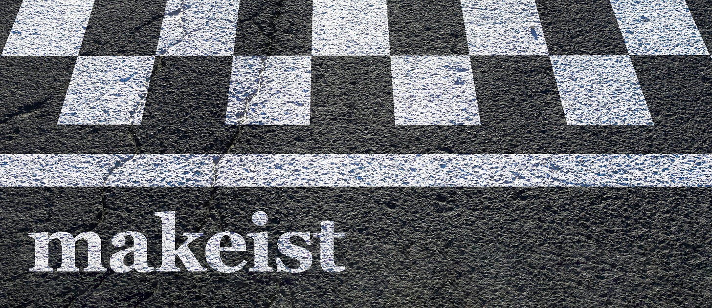 Makeist logo over asphalt with white painted finish line stripes.