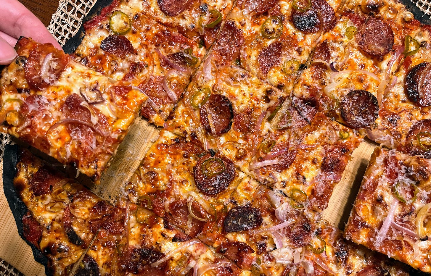 Cooked tavern style pizza, cut party style