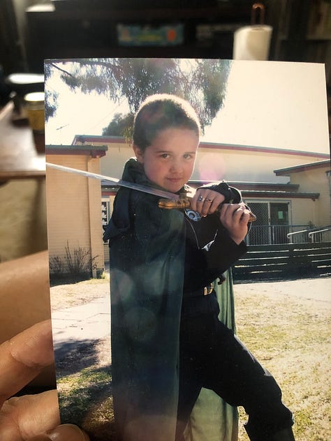 Gaden aged 8 plays with swords. They are very serious and concentrated.
