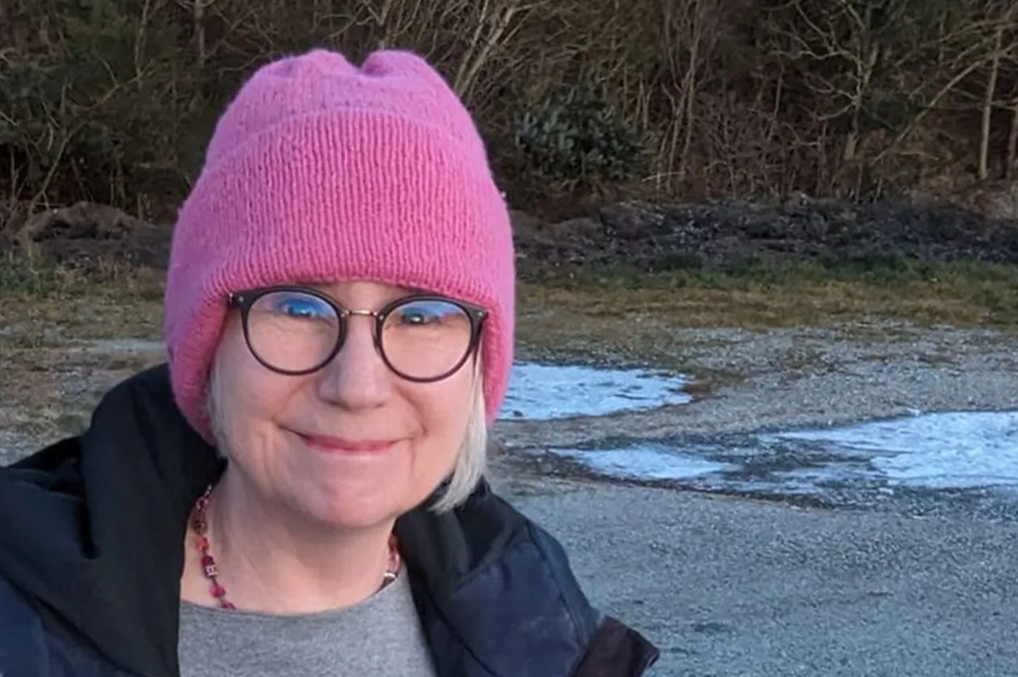 Woman in pink hand knitted hat