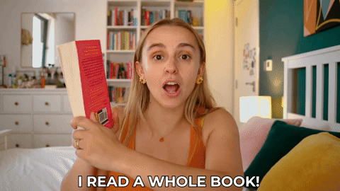Hannah flicking through a book and saying, "I read a whole book"
