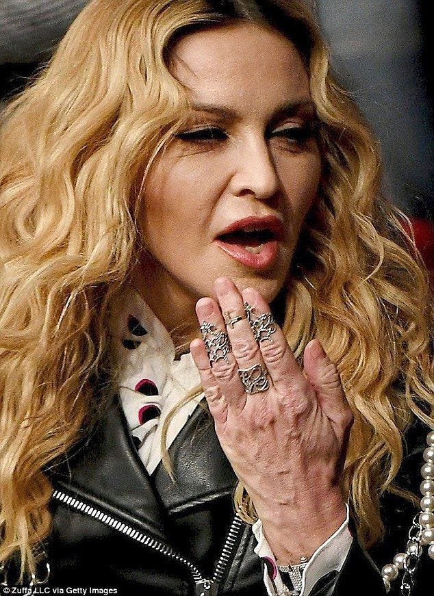 Madonna's age gap... between her face and hand Madonna's age gap... between her face and hand