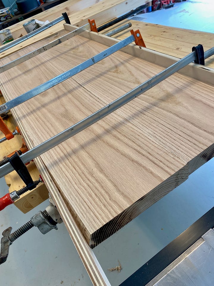 Red oak being surfaced, planed and glued together.