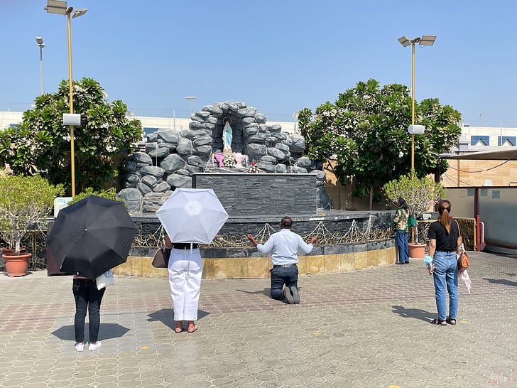 Catholics pray at a grotto statue of the Blessed Virgin Mary, at St. Mary's Catholic Church, Dubai. Credit: JD Flynn/Pillar Media.