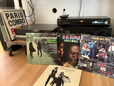 Music albums and CDs, stereo and boombox, and Simon and Garfunkel, the Who, Fleetwood Mac, and BB King