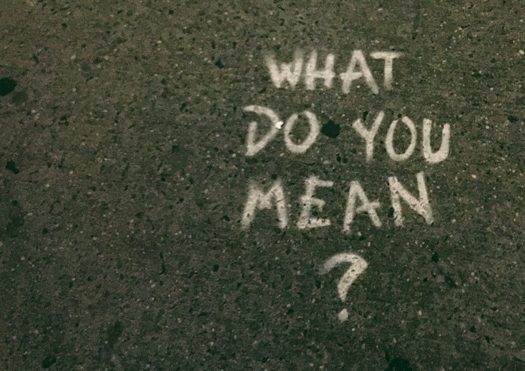 what do you mean? text on gray surface